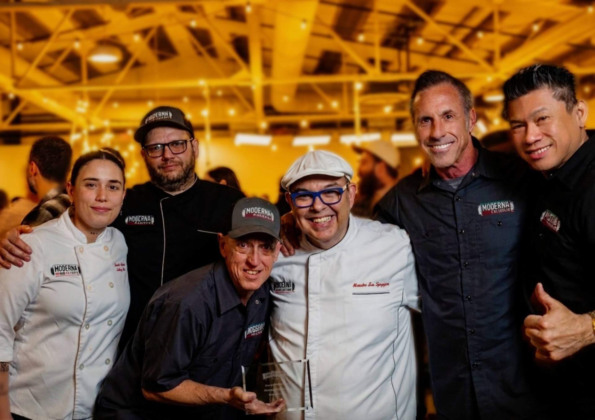 The Moderna Bar & Pizzeria team — chefs, pizzaiolos, and front-of-house family with Maestro Leo Spizzirri